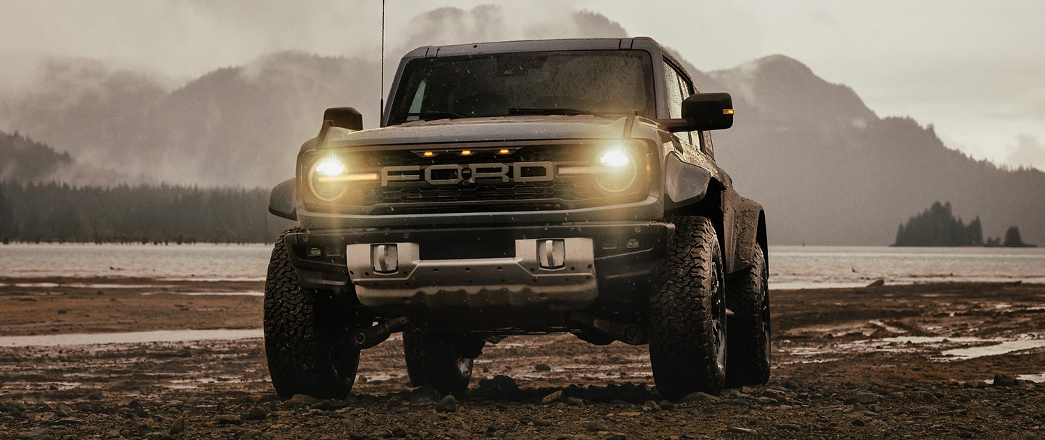 2025 Bronco parked offroad surrounded by mountains and trees