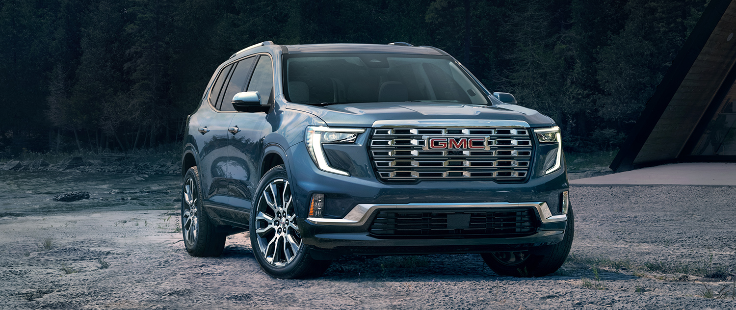 2025 GMC Acadia parked in the woods