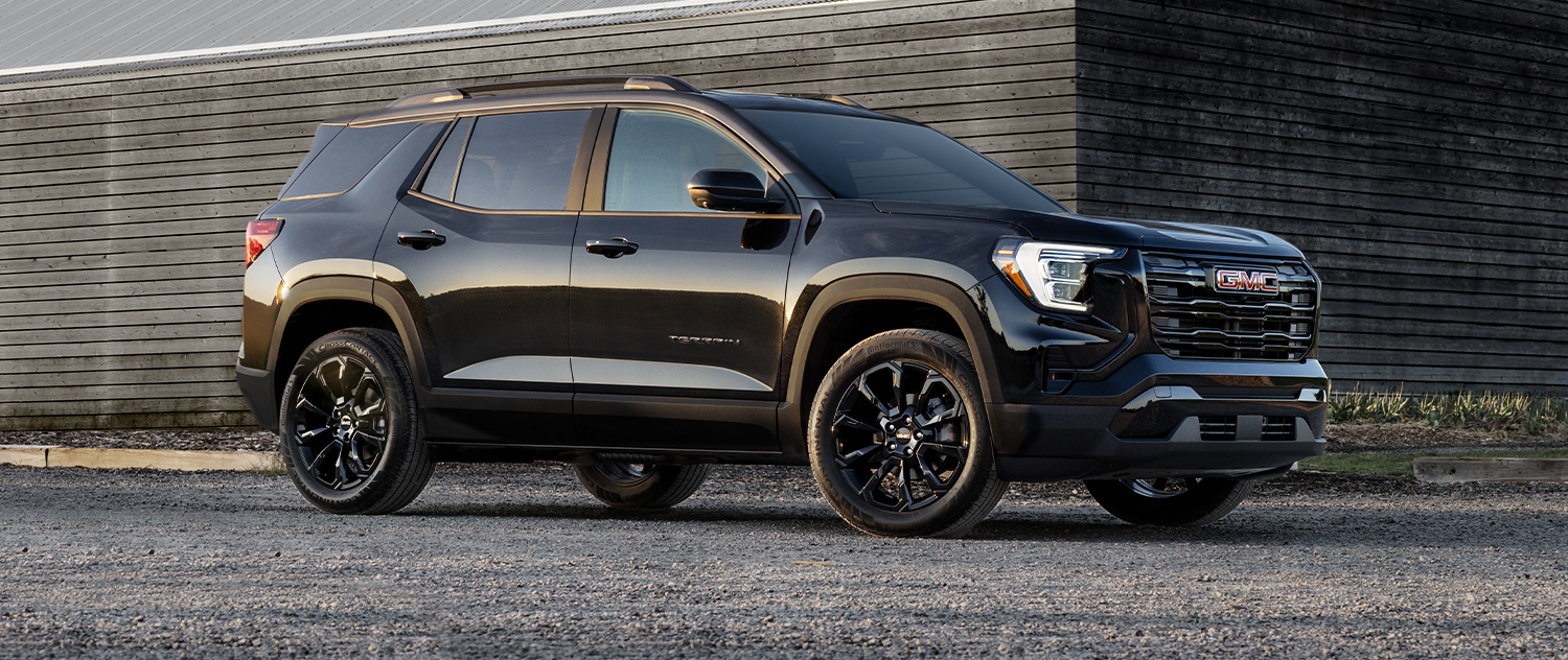 GMC Terrain 3/4 view parked outside a building