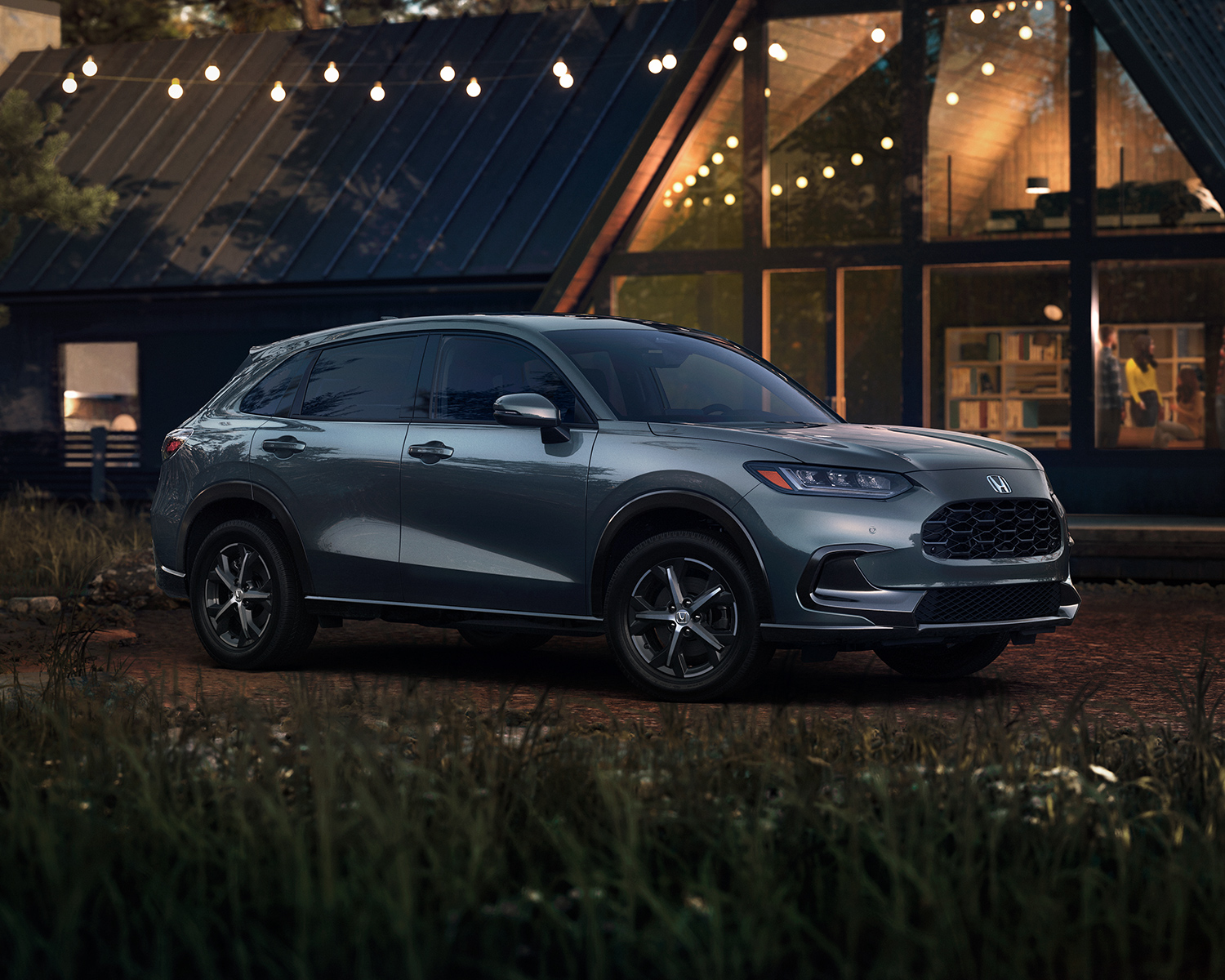 2025 Honda HR-V parked outside a cabin at night