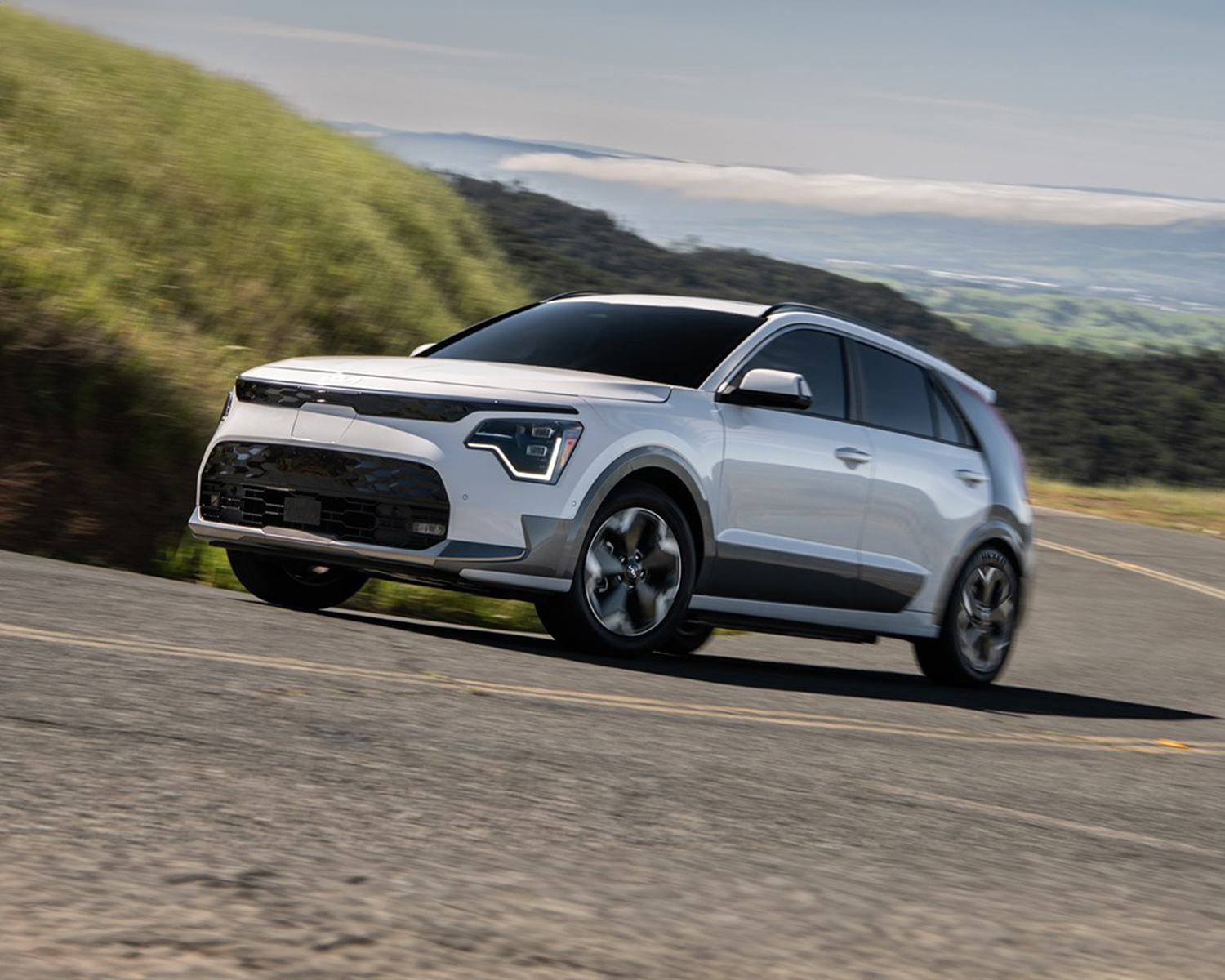 2025 Kia Niro EV Driving By A Lake