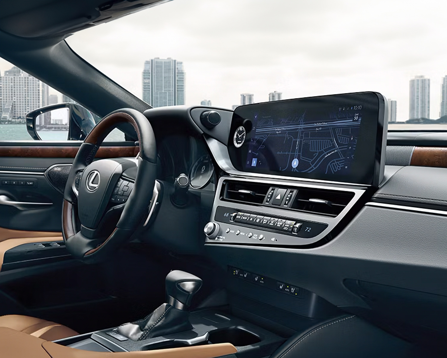 2025 Lexus ES interior with steering wheel, digital display, and beige leather seats.
