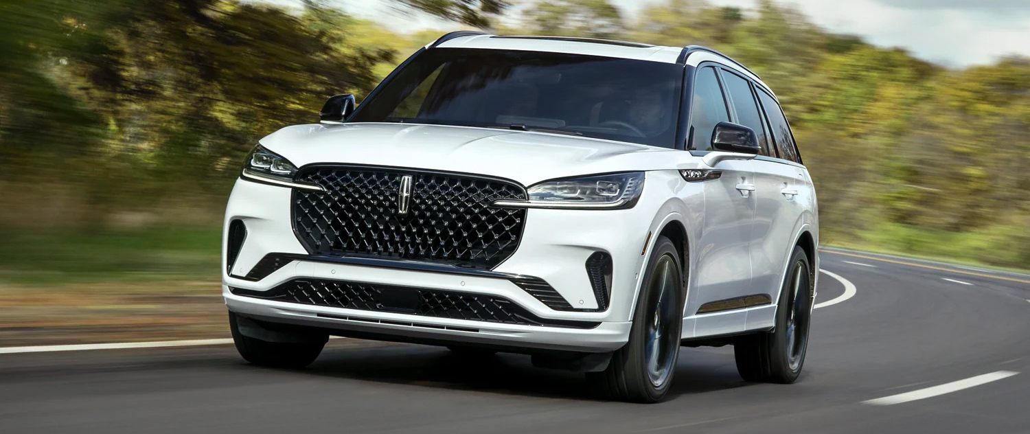 2025 Lincoln Aviator driving along a winding road
