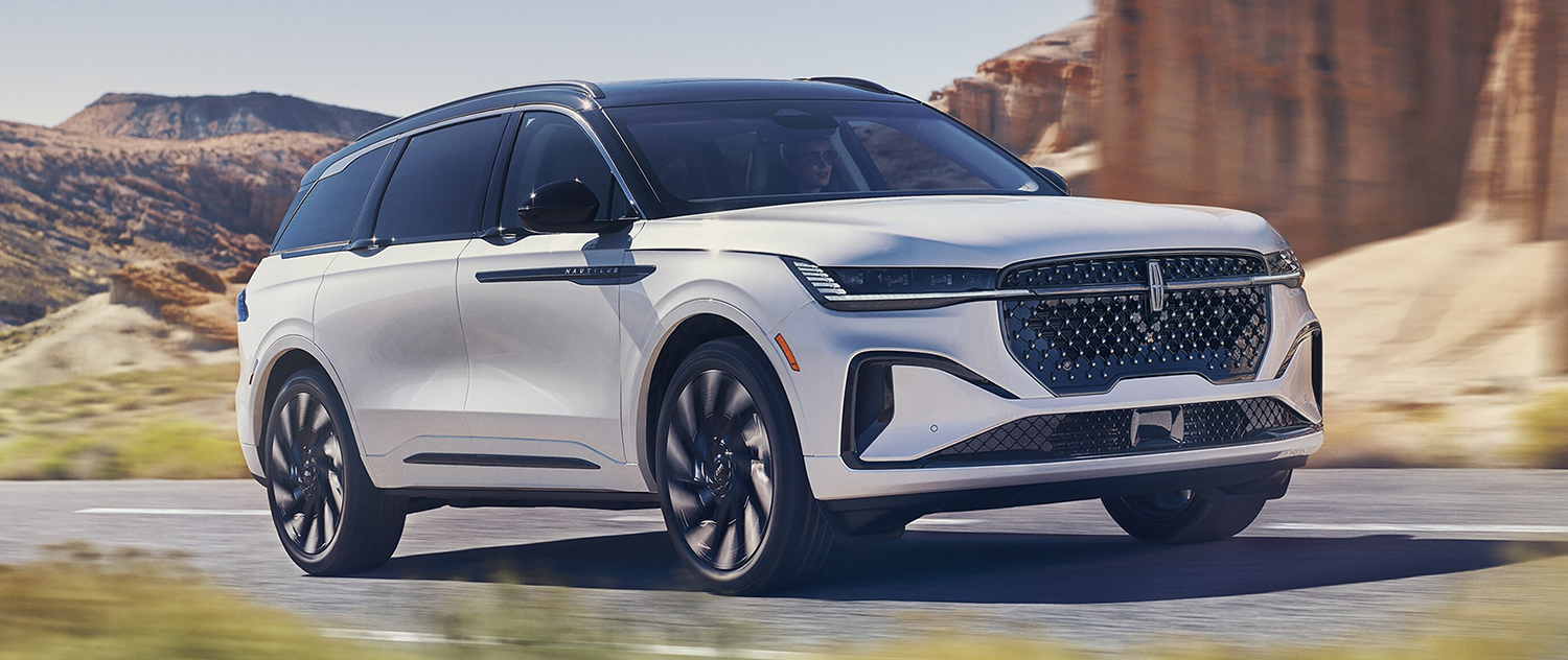 The 2025 Lincoln Nautilus® driving down a road in the desert