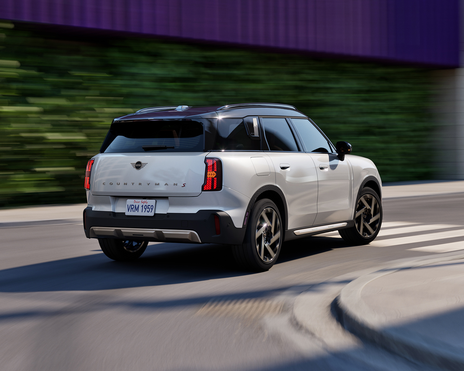 Rear shot of a 2025 MINI Countryman driving on a street.