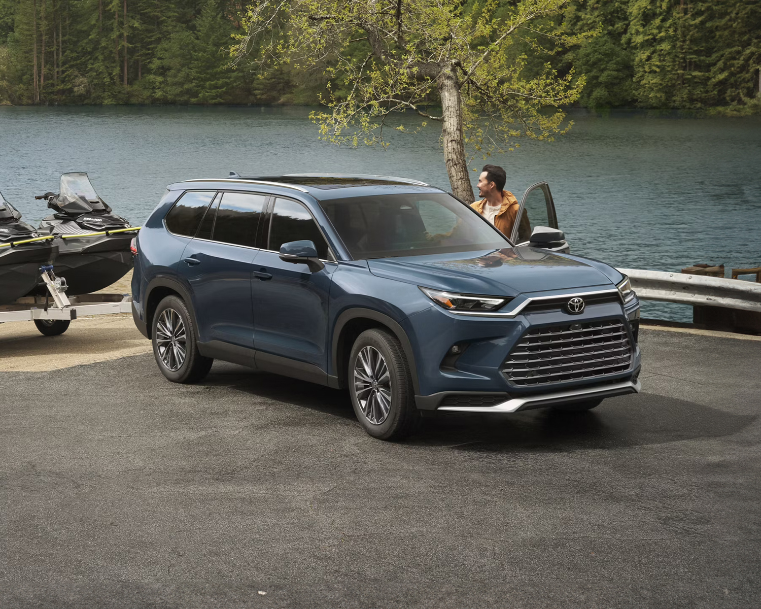 2025 Toyota Grand Highlander towing jetskis out of the water