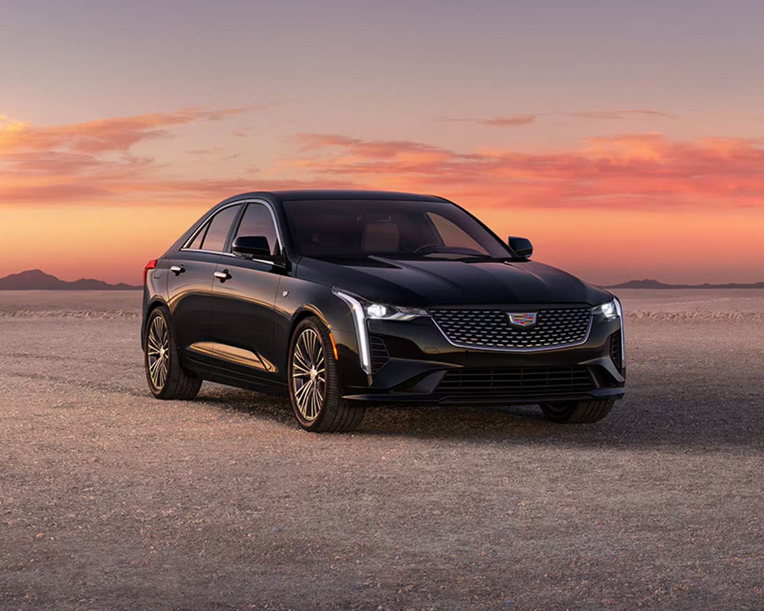 Cadillac CT4 parked offroad in the desert.