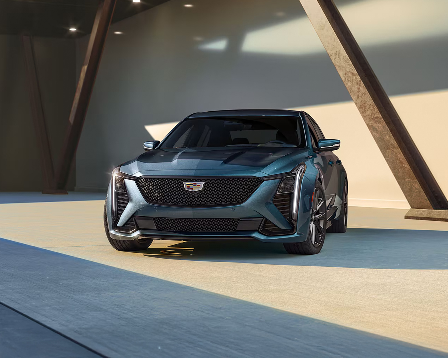 Cadillac CT5 parked under a modern building