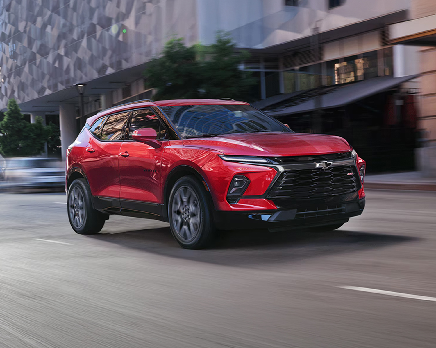 Chevy Blazer driving down a city street