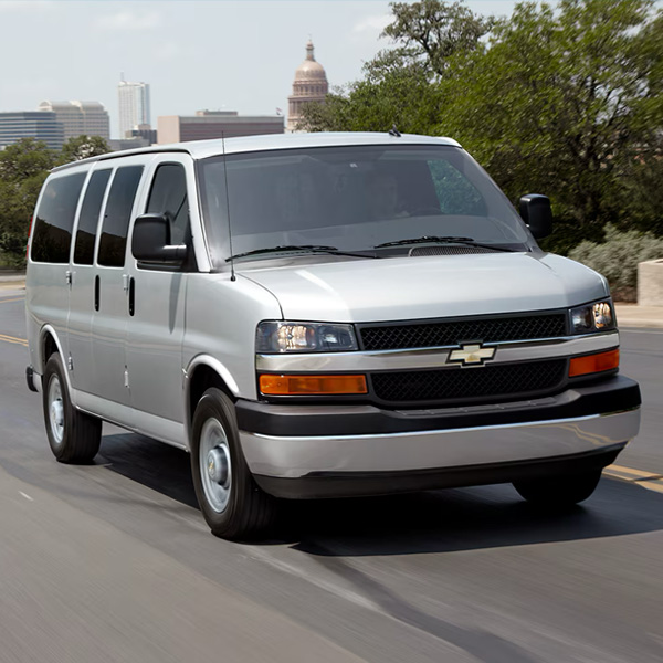 Chevy Express Van driving on the road