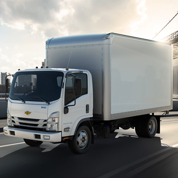 Chevy Low Cab Forward driving on a highway road