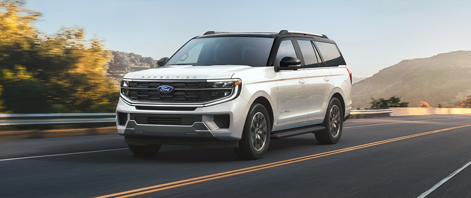 New Ford SUV driving down a highway