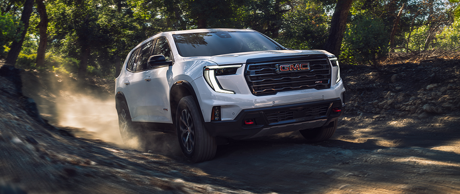 2026 GMC Acadia offroading in the woods