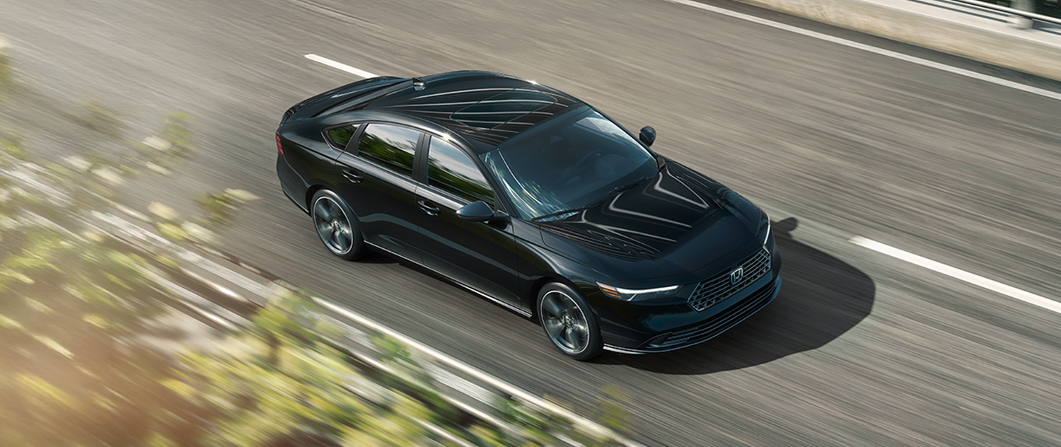New Honda Accord cruising down a highway