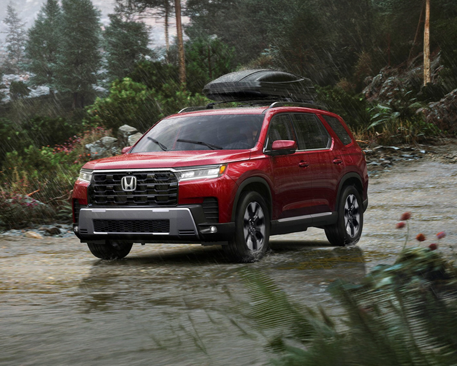2026 Honda Pilot driving through the rain