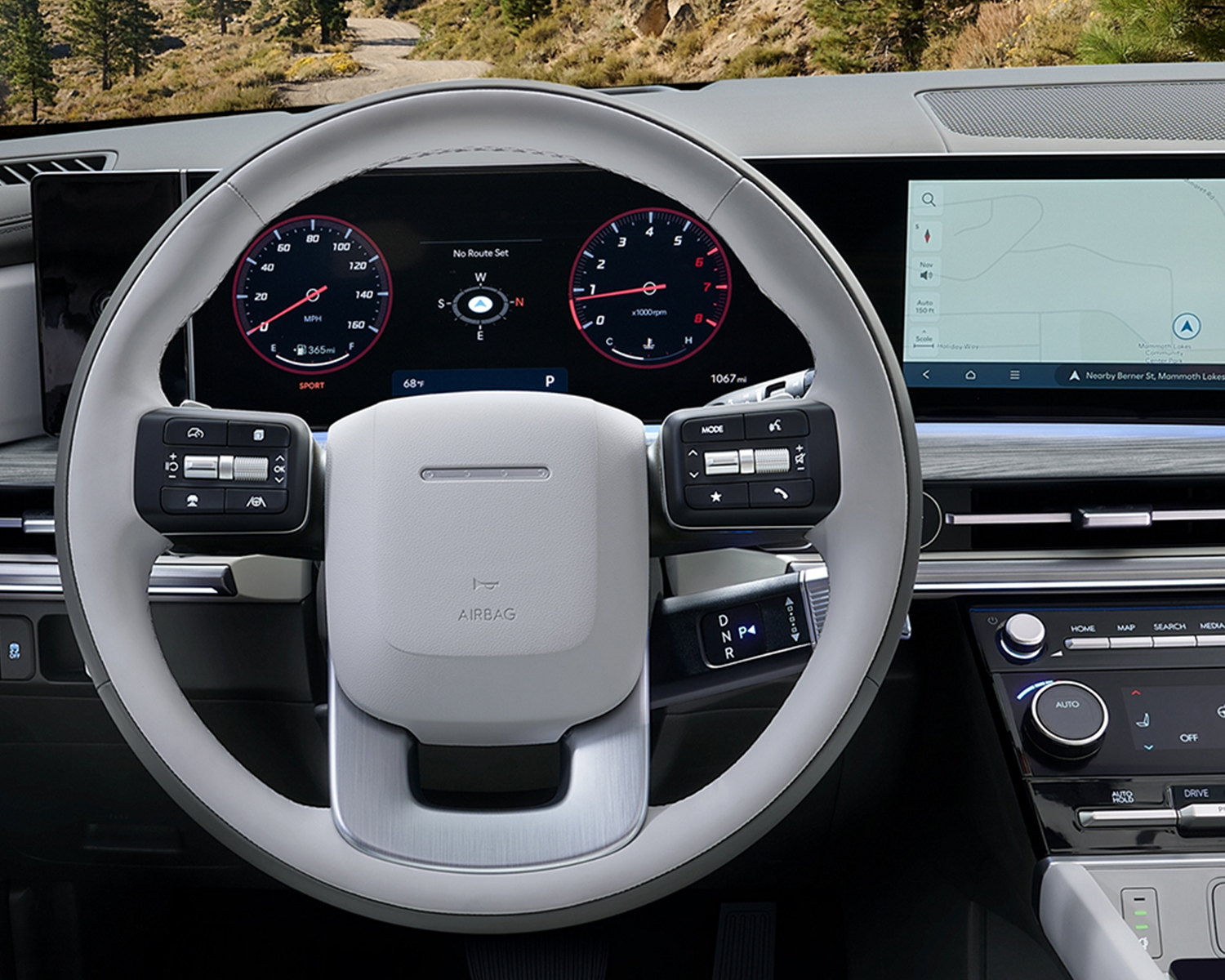 Interior shot of the sterring wheel and dashboard in a 2026 Hyundai Santa Fe Hybrid