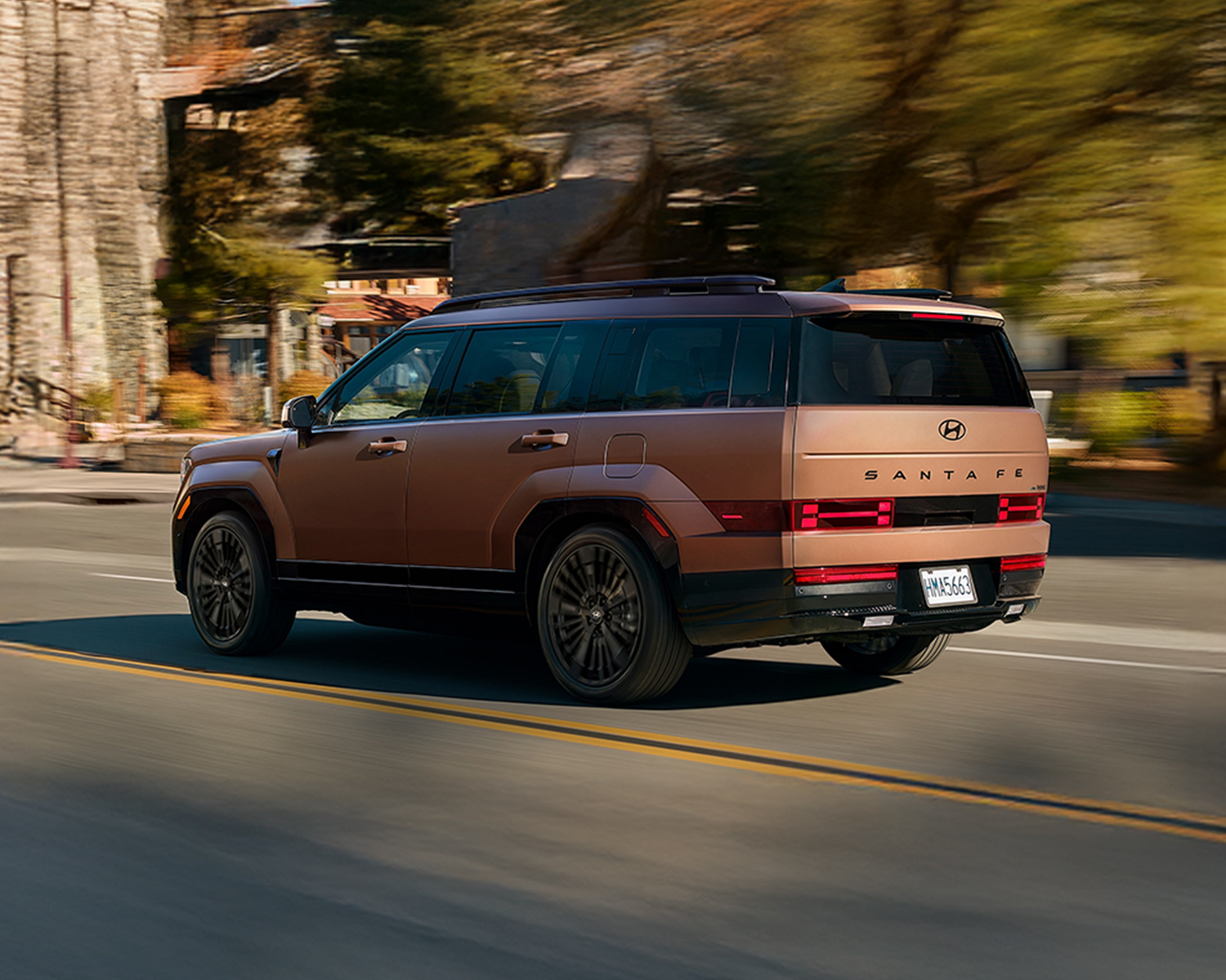 2026 Hyundai Santa Fe Hybrid driving through town