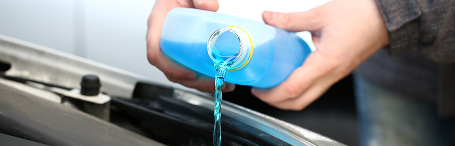coolant being poured into car