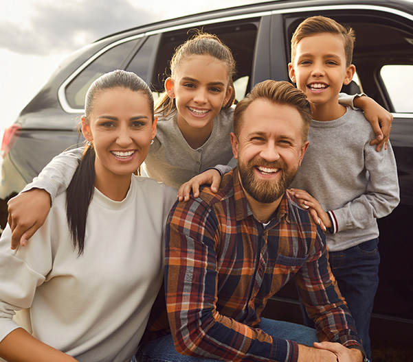 Family next to SUV