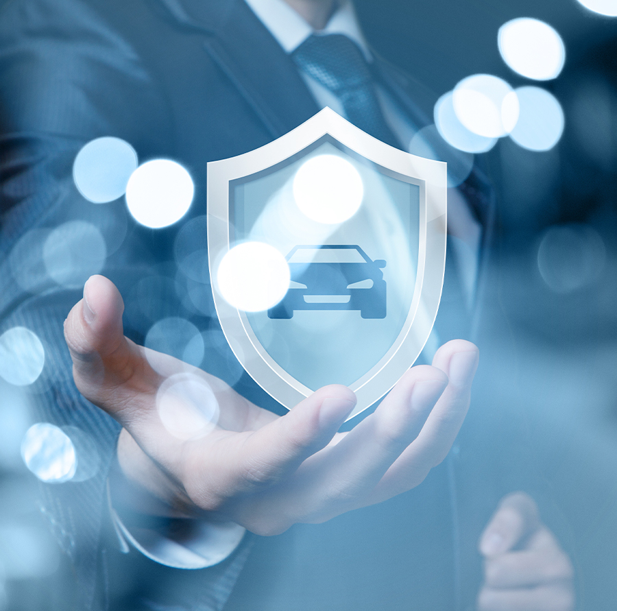 Man shows a shield with a car.