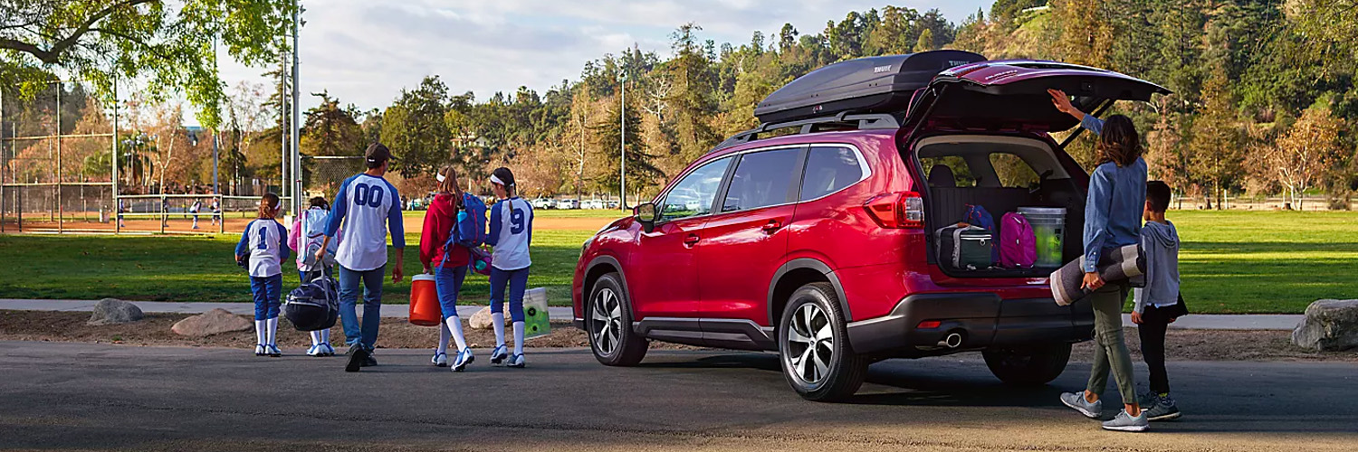 A family loads gear into the power rear gate of a 2024 Subaru Ascent