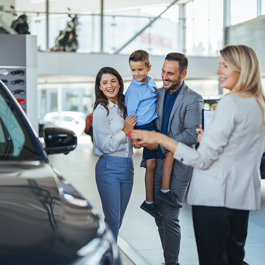 happy fmaily in dealership