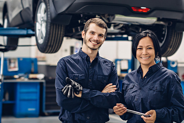 Happy workers at a dealership