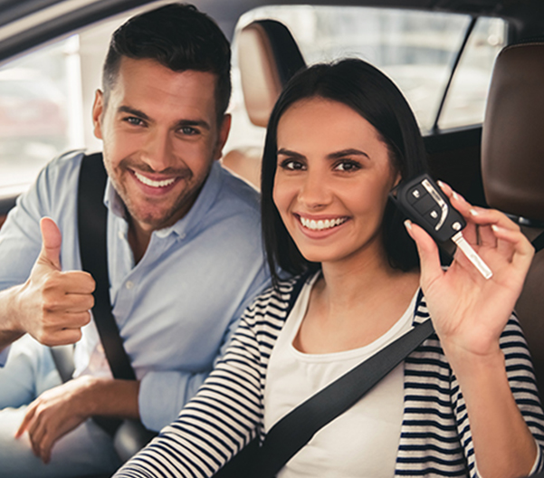 Happy couple holding car key