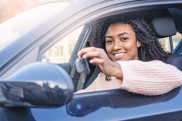 Happy woman in a car