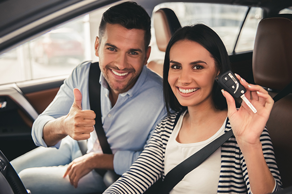 Couple in car with key